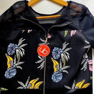 Elegant top with mesh accents.  Can be worn as a top or jacket.